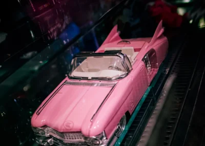 Miniature pink 1950s convertible model car